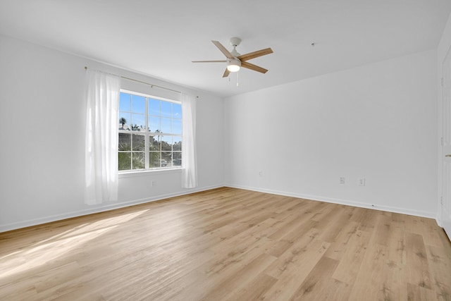 unfurnished room featuring ceiling fan and light wood-type flooring