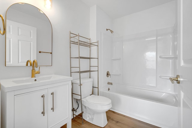 full bathroom featuring shower / bath combination, vanity, wood-type flooring, and toilet