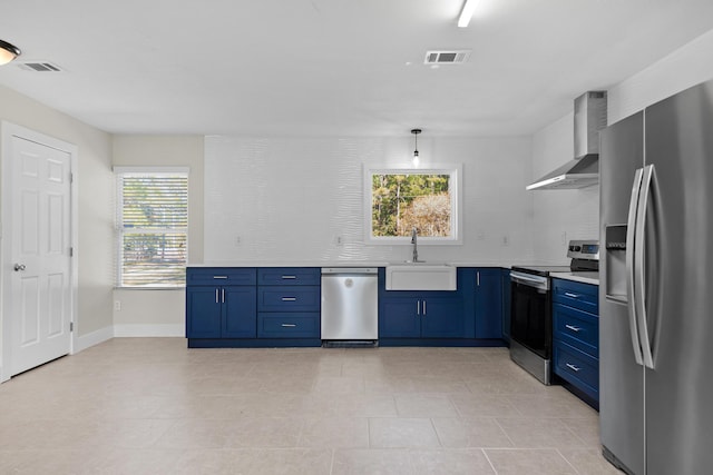 kitchen featuring plenty of natural light, sink, wall chimney range hood, and stainless steel appliances