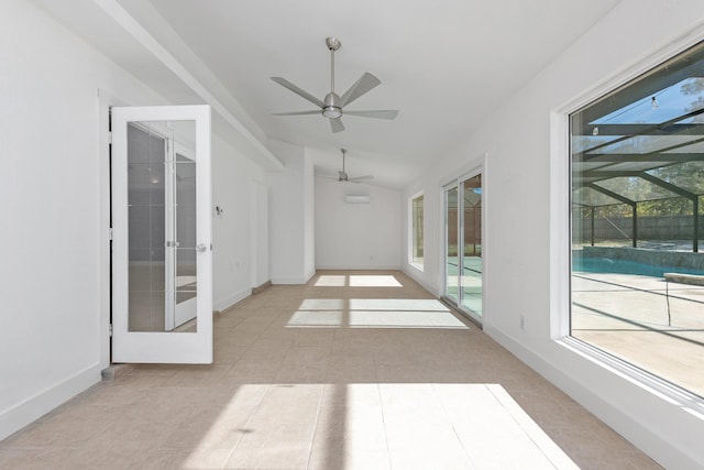 unfurnished sunroom featuring french doors, vaulted ceiling, plenty of natural light, and ceiling fan