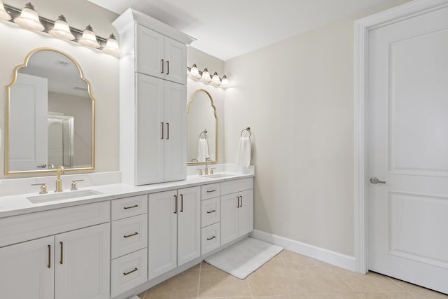 bathroom with tile patterned flooring and vanity