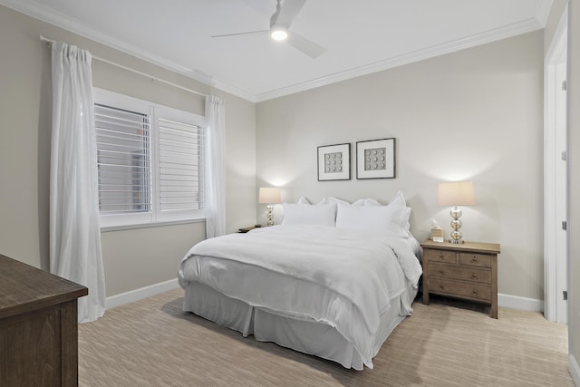 carpeted bedroom with ceiling fan and crown molding