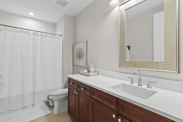 full bathroom with tile patterned floors, shower / tub combo with curtain, vanity, and toilet