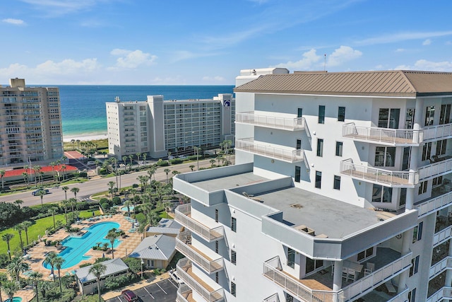 drone / aerial view featuring a view of the beach and a water view