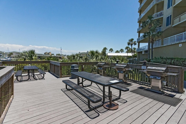 wooden terrace with a grill