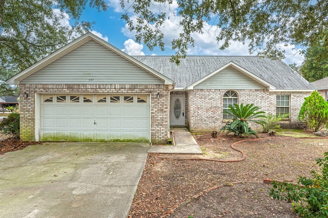 ranch-style home featuring a garage