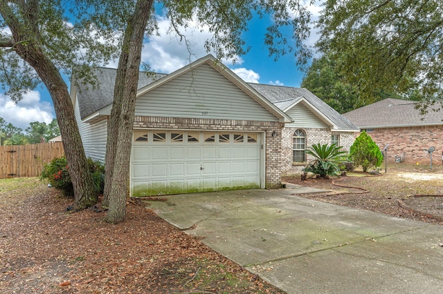 ranch-style house featuring a garage