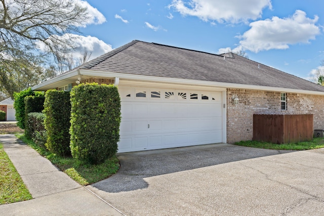 view of side of property featuring a garage