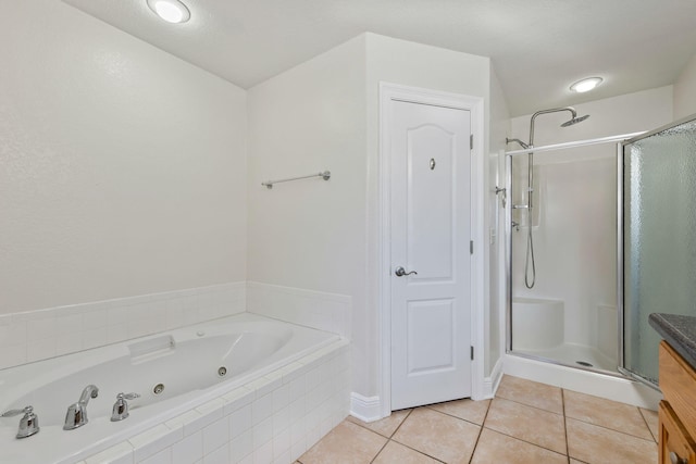 bathroom with tile patterned flooring and independent shower and bath
