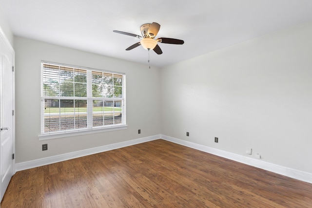 unfurnished room with ceiling fan and dark hardwood / wood-style floors