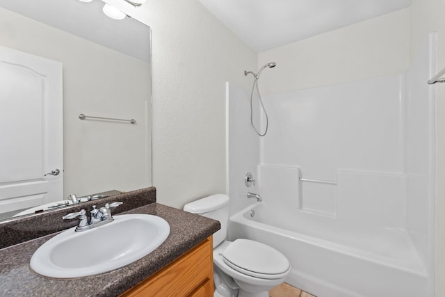 full bathroom with tile patterned floors, vanity,  shower combination, and toilet