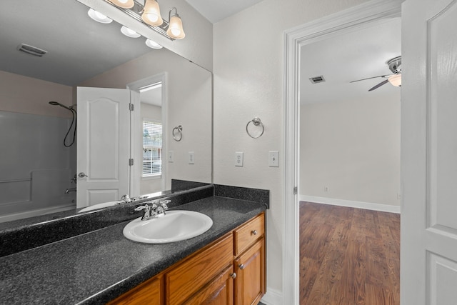 bathroom featuring ceiling fan, vanity, and hardwood / wood-style flooring