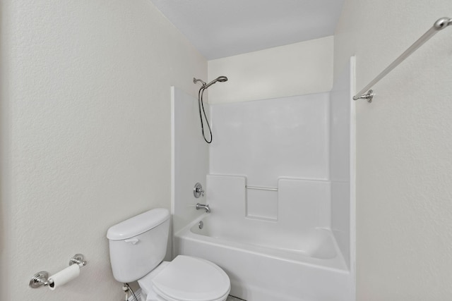 bathroom with shower / tub combination and toilet