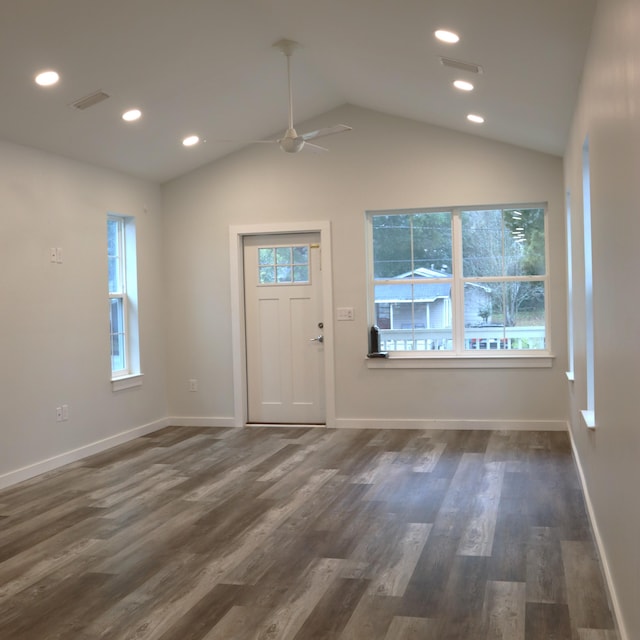 foyer entrance with dark hardwood / wood-style flooring, ceiling fan, plenty of natural light, and lofted ceiling