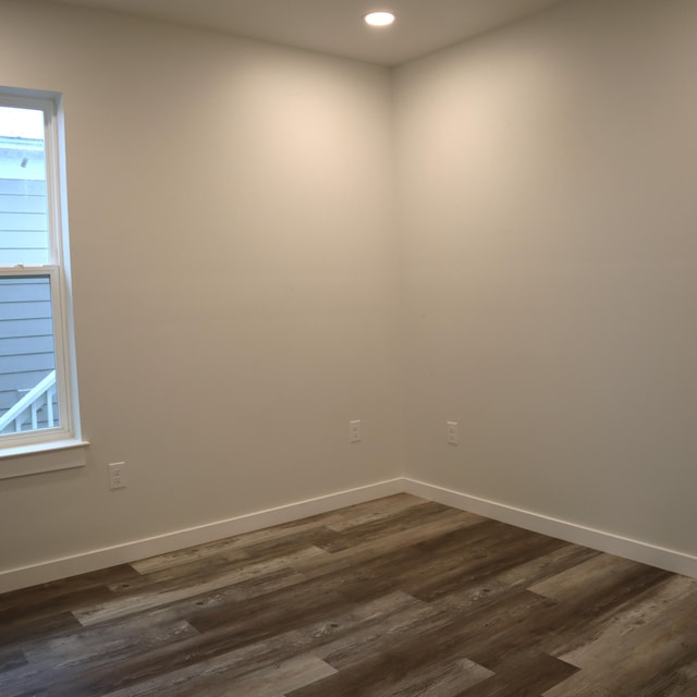 empty room featuring dark hardwood / wood-style floors