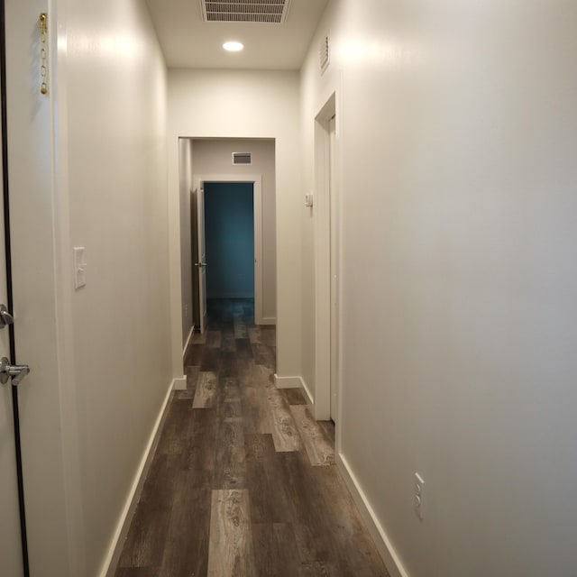 hallway featuring dark wood-type flooring