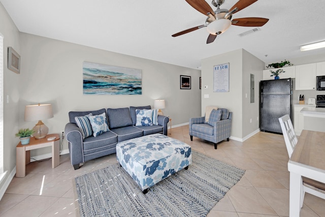 tiled living room with ceiling fan