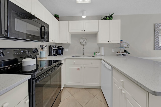 kitchen featuring black appliances, sink, light tile patterned floors, a textured ceiling, and white cabinetry