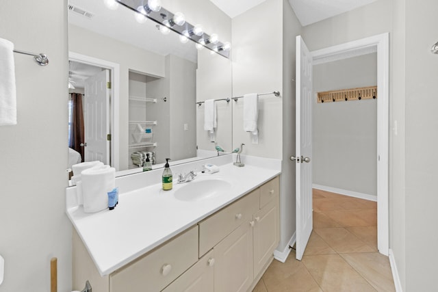 bathroom with tile patterned flooring and vanity