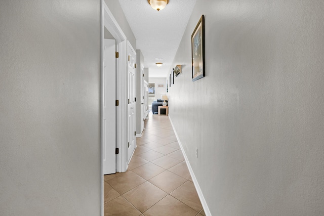 corridor featuring light tile patterned flooring