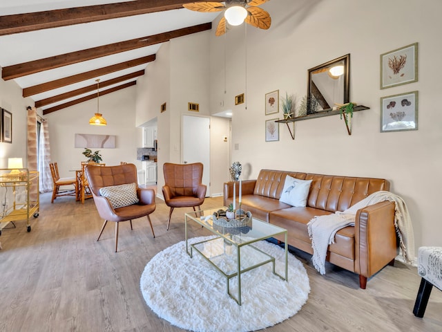 living room with beamed ceiling, ceiling fan, high vaulted ceiling, and hardwood / wood-style flooring