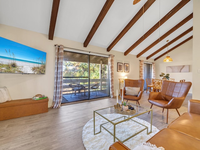 living room featuring beamed ceiling, hardwood / wood-style flooring, and high vaulted ceiling