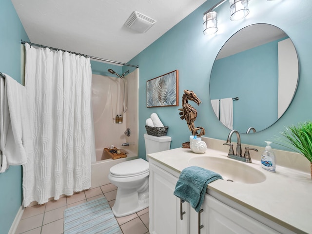 full bathroom with tile patterned floors, vanity, toilet, and shower / bath combo with shower curtain