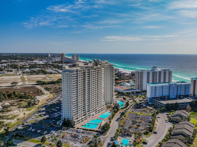 bird's eye view with a water view and a beach view