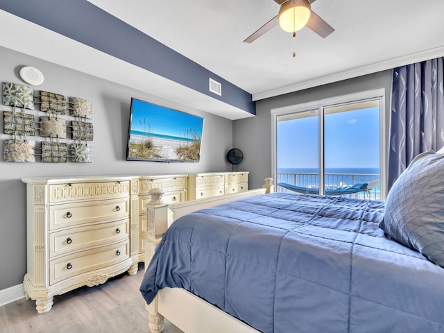 bedroom with access to exterior, hardwood / wood-style flooring, and ceiling fan