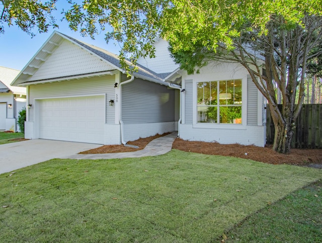 view of front of house with a front lawn and a garage