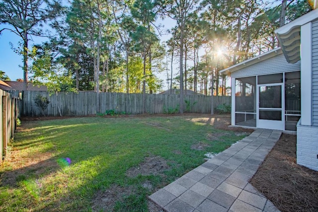 view of yard with a sunroom