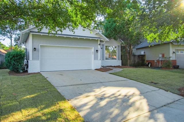 view of front of home with a front lawn and a garage