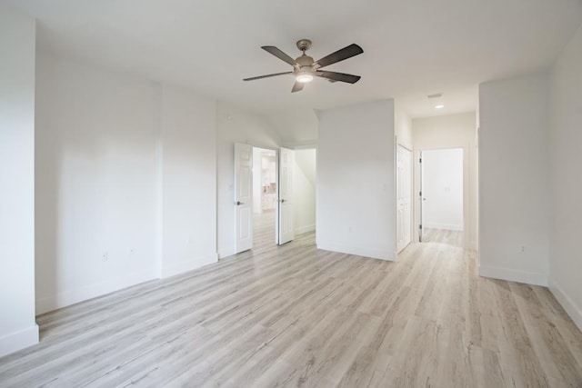 spare room with light hardwood / wood-style flooring and ceiling fan