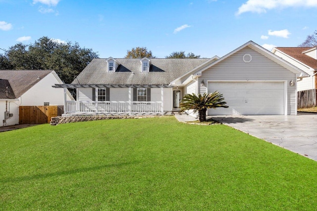 view of front of property with covered porch, a front yard, and a garage