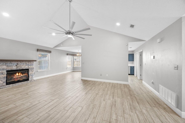 439 Northview Ln, Crestview, FL 32536 - unfurnished living room featuring a stone fireplace, a ceiling fan, light wood-style floors, high vaulted ceiling, and recessed lighting
