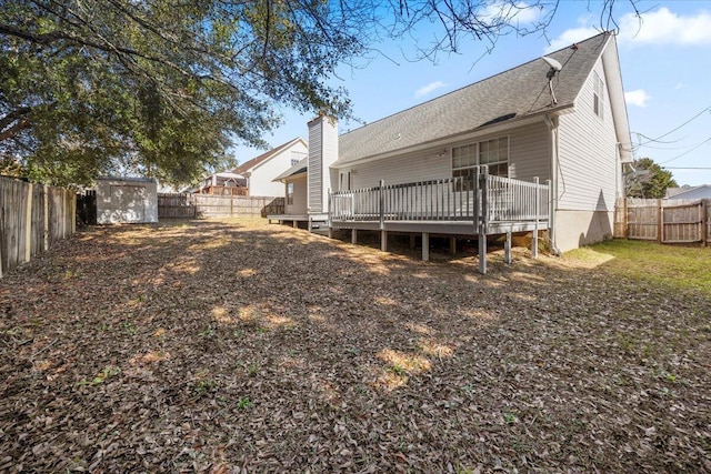439 Northview Ln, Crestview, FL 32536 - rear view of house featuring a storage shed, a deck, an outbuilding, and a fenced backyard