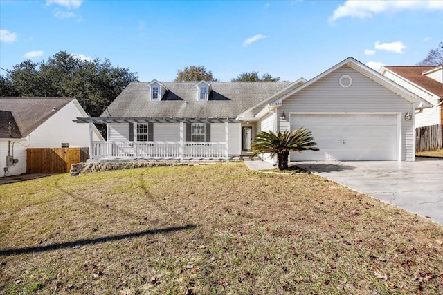 439 Northview Ln, Crestview, FL 32536 - cape cod house featuring a garage, fence, covered porch, and driveway