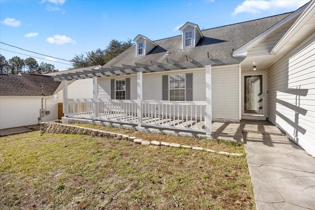 439 Northview Ln, Crestview, FL 32536 - view of front of home featuring a porch, a pergola, a front yard, and roof with shingles