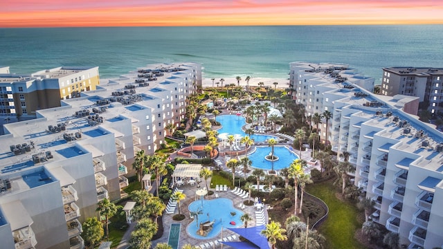 1110 Santa Rosa Blvd Unit C303, Fort Walton Beach, FL 32548 - aerial view at dusk of view of pool area, a water view, and a view of apartment building / complex