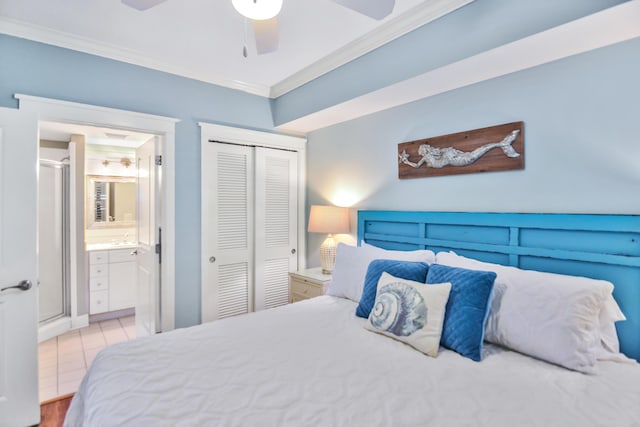 1110 Santa Rosa Blvd Unit C303, Fort Walton Beach, FL 32548 - bedroom featuring crown molding, a closet, ensuite bathroom, and a ceiling fan