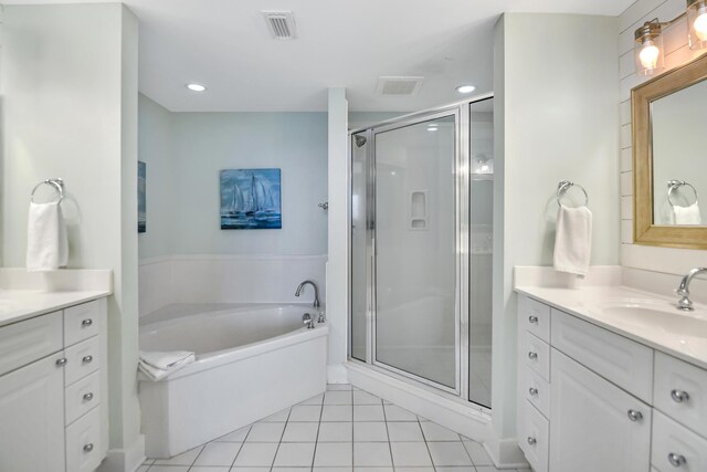 bathroom featuring tile patterned flooring, vanity, and separate shower and tub