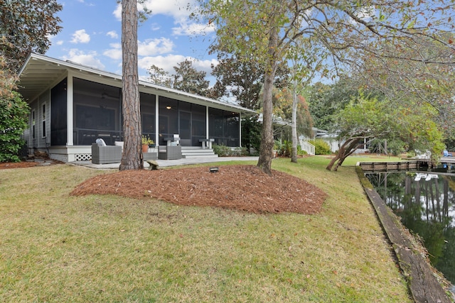 view of yard featuring a sunroom and central air condition unit