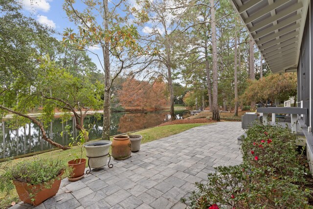 view of patio featuring a water view