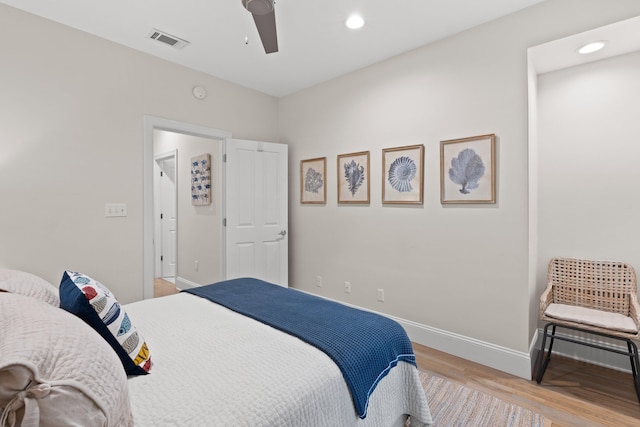 bedroom featuring ceiling fan and light hardwood / wood-style floors