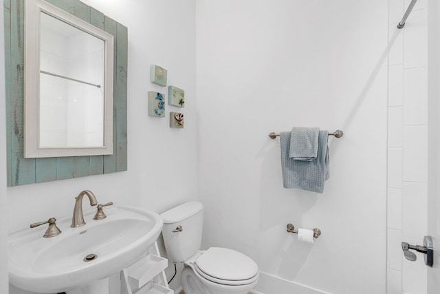 bathroom with toilet and sink