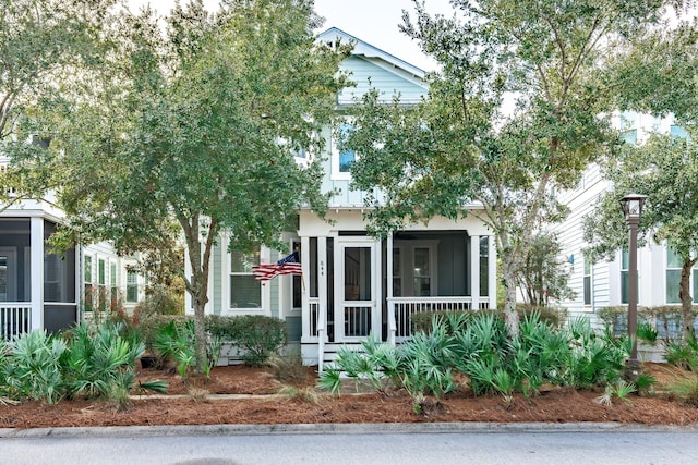 view of front of home featuring a sunroom