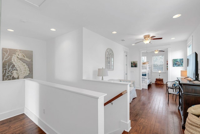 hallway with dark hardwood / wood-style flooring