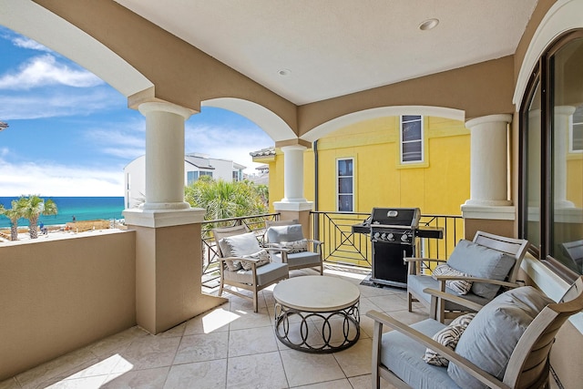 balcony featuring a grill and a water view