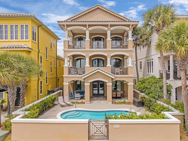 exterior space with a balcony and a patio