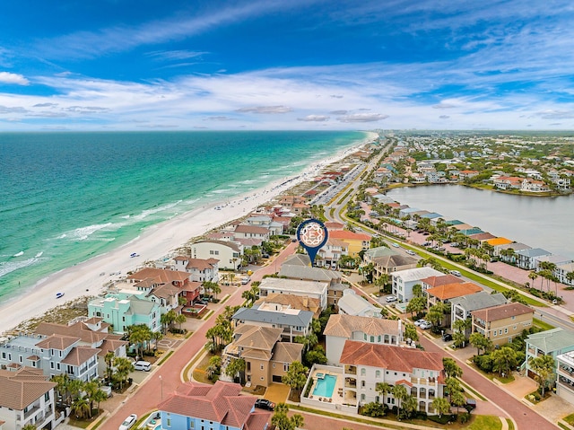 birds eye view of property featuring a view of the beach and a water view